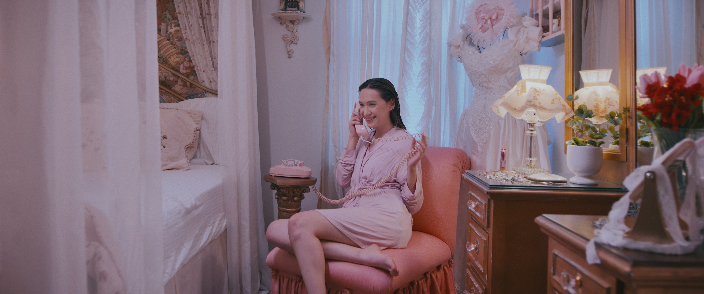 GLIMMR – Woman on pink phone in robe in bedroom